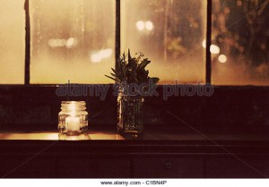 old-glass-window-factory-jar-candle-lit-vintage-c1bn4p