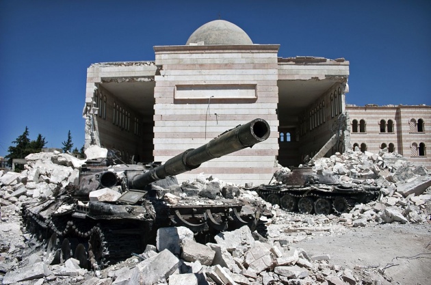 Two tanks in front of a mosque in Azaz, Syria, following a battle between the Free Syrian Army (FSA) and the Syrian governmen
