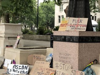 Anti-racist placards at the Stop Asian Hate demo
